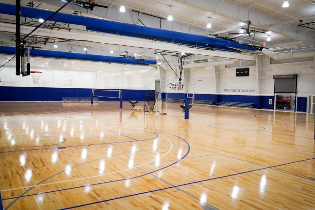 Fieldhouse floor set up with multiple volleyball courts